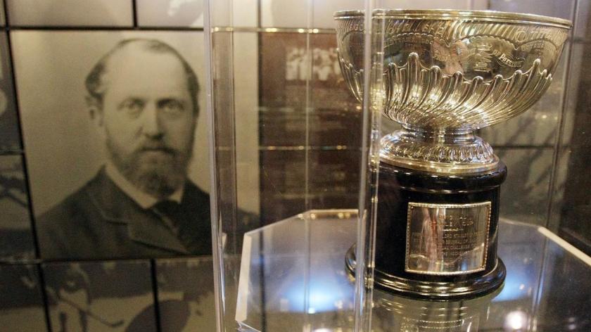 The original Stanley Cup with a photo of Lord